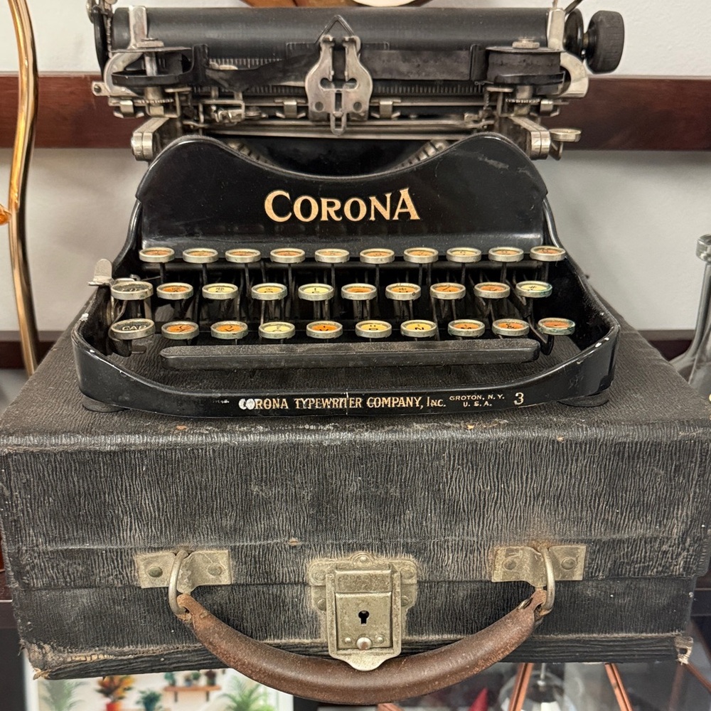Corona Black Portable Typewriter with Gold Logo